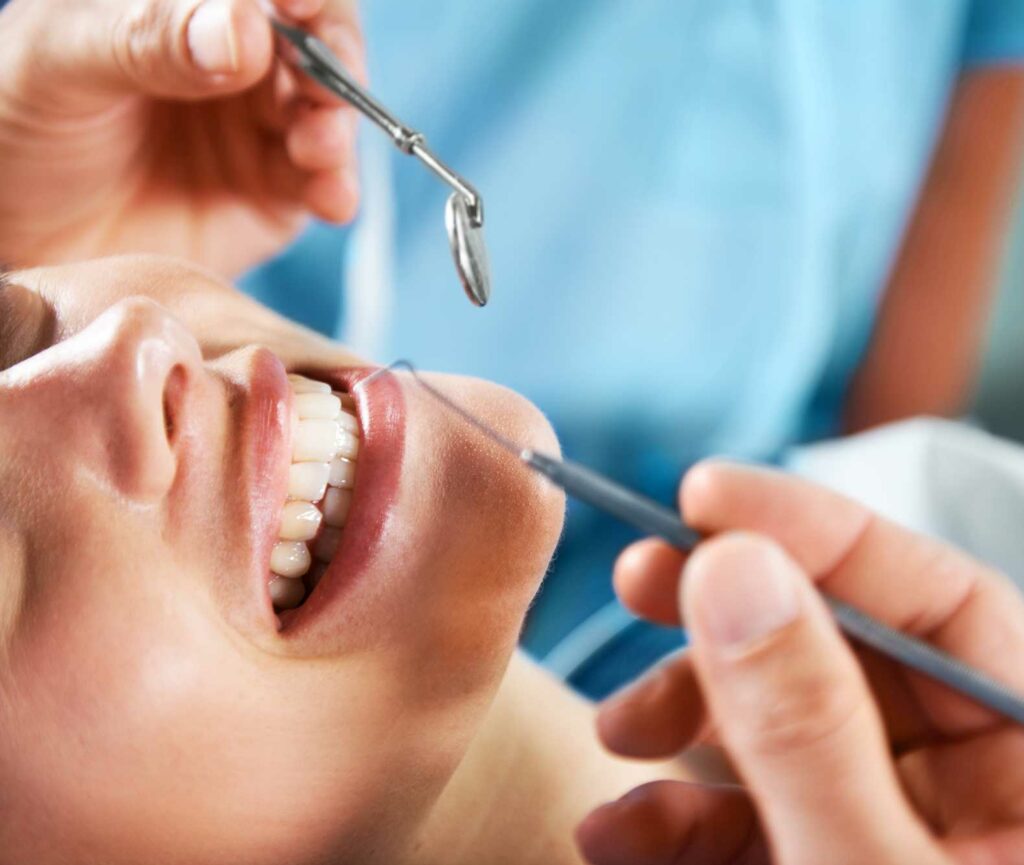 Patient receiving a dental cleaning as part of a regular dental checkup