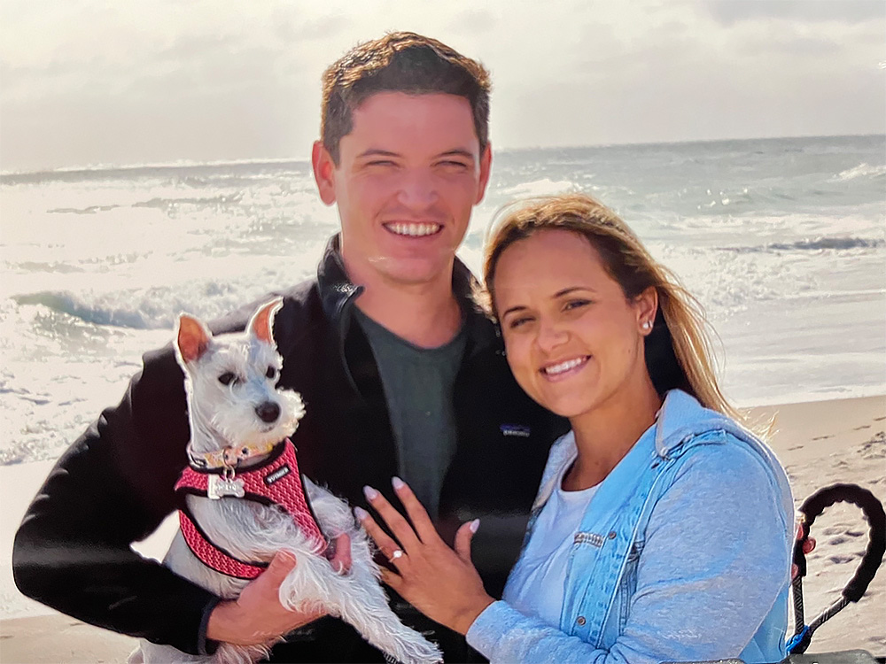 Dr. Matthew Dillon with his dog and fiance